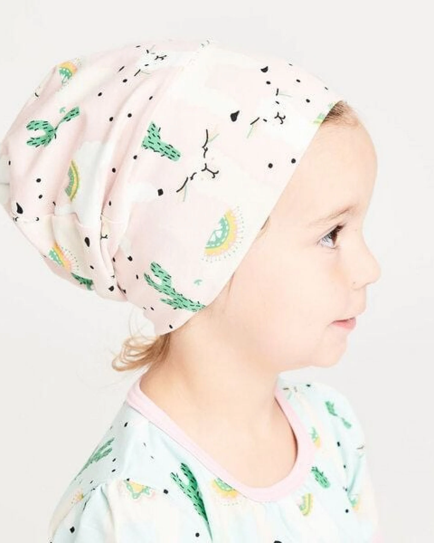 Cheeky Apple Gefütterte Baby-Haube aus Bio-Baumwolle "Alpakas" Türkis/Rosa – Ansicht 4