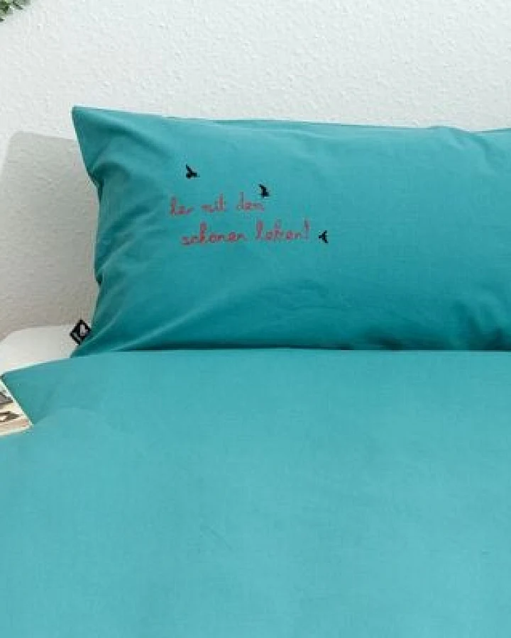 Hirschkind Bio-Kissenbezug 'her mit dem schönen leben!' türkis 80*40 cm