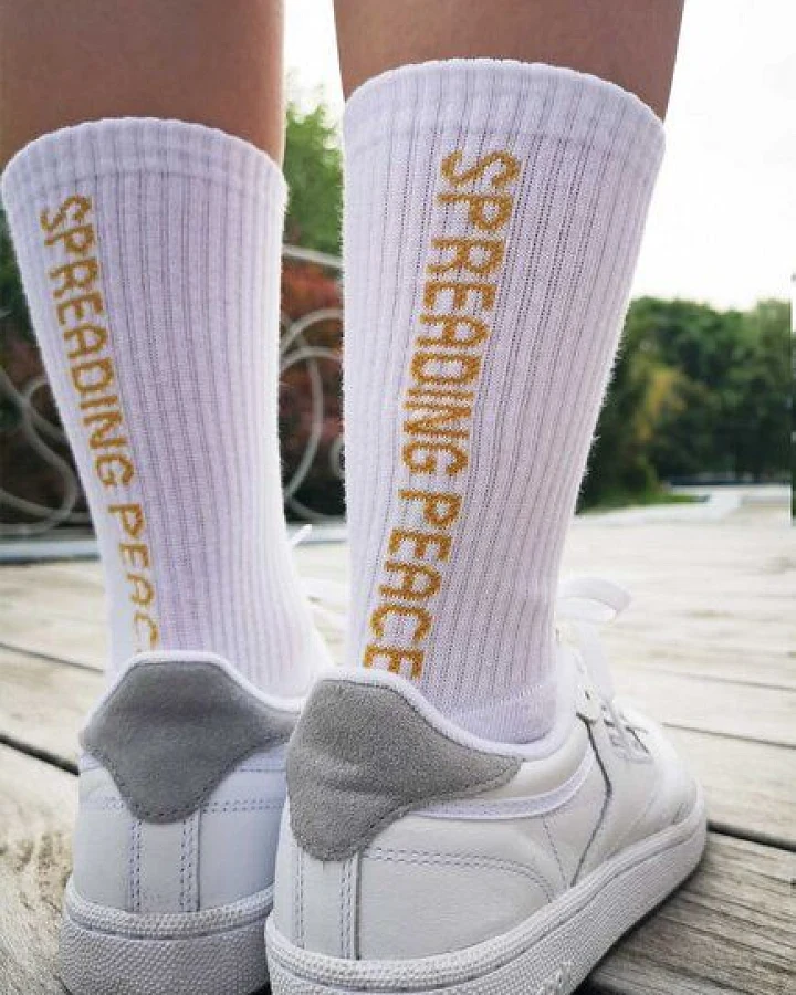 SPARKLES OF LIGHT SPREADING PEACE Unisex Sportsocken aus Biobaumwolle